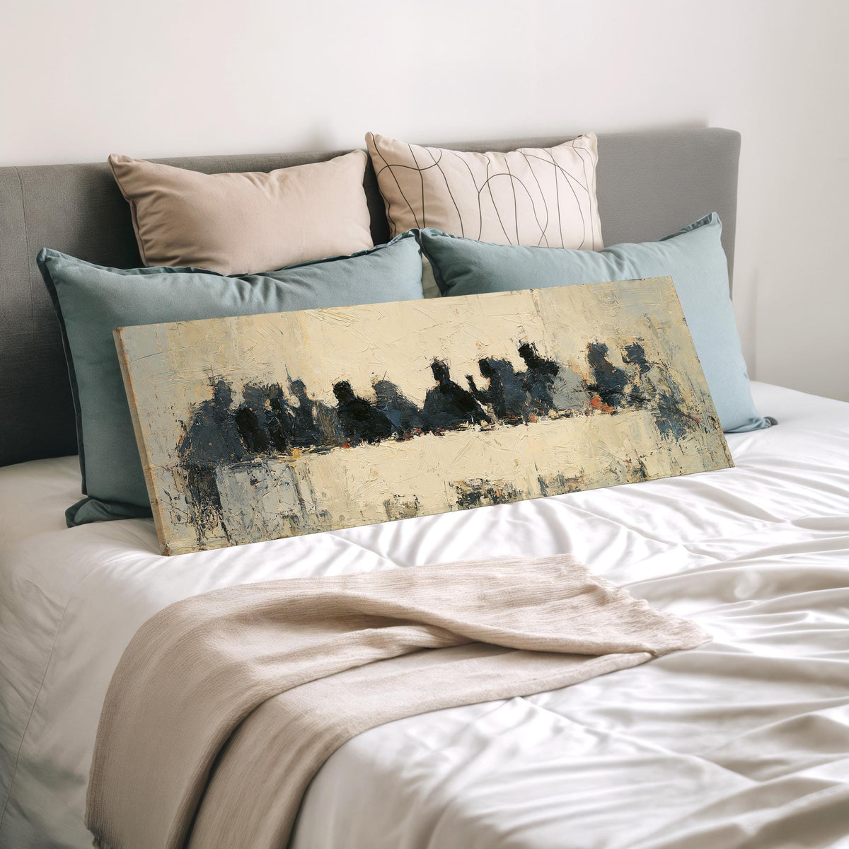 Abstract silhouette Last Supper wide panoramic canvas print laid on a bed to show its size