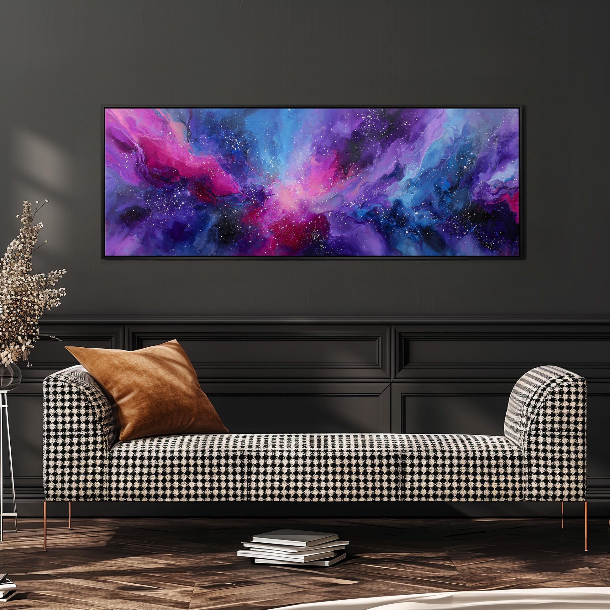 a large, colorful abstract painting hanging on a wall above a black and white checkered sofa in a modern living room setting.