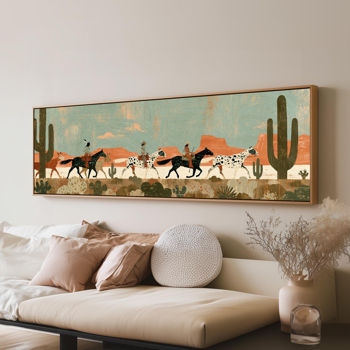 Riders on spotted horses across a red rock desert long horizontal canvas print above a sofa in a living room