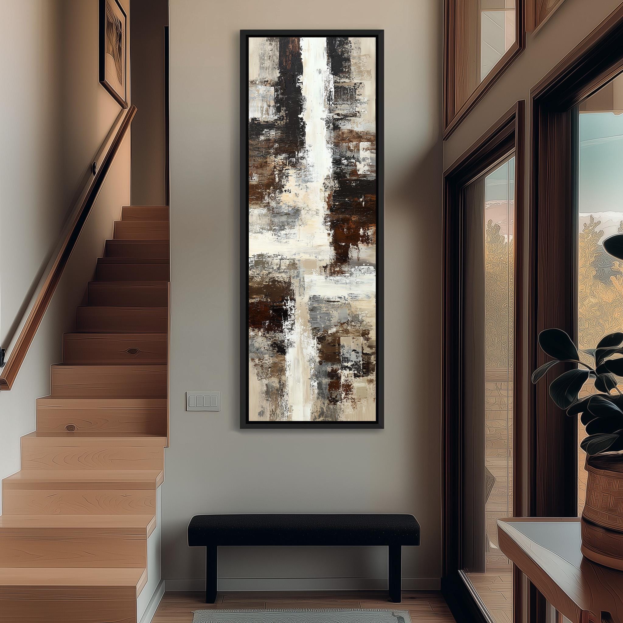 a modern interior design with a large abstract painting hanging on the wall above a black bench. The painting has a mix of brown, white, and gray colors, creating a visually striking contrast. The room also includes a staircase, a potted plant, and a window, contributing to the overall aesthetic and atmosphere of the space.