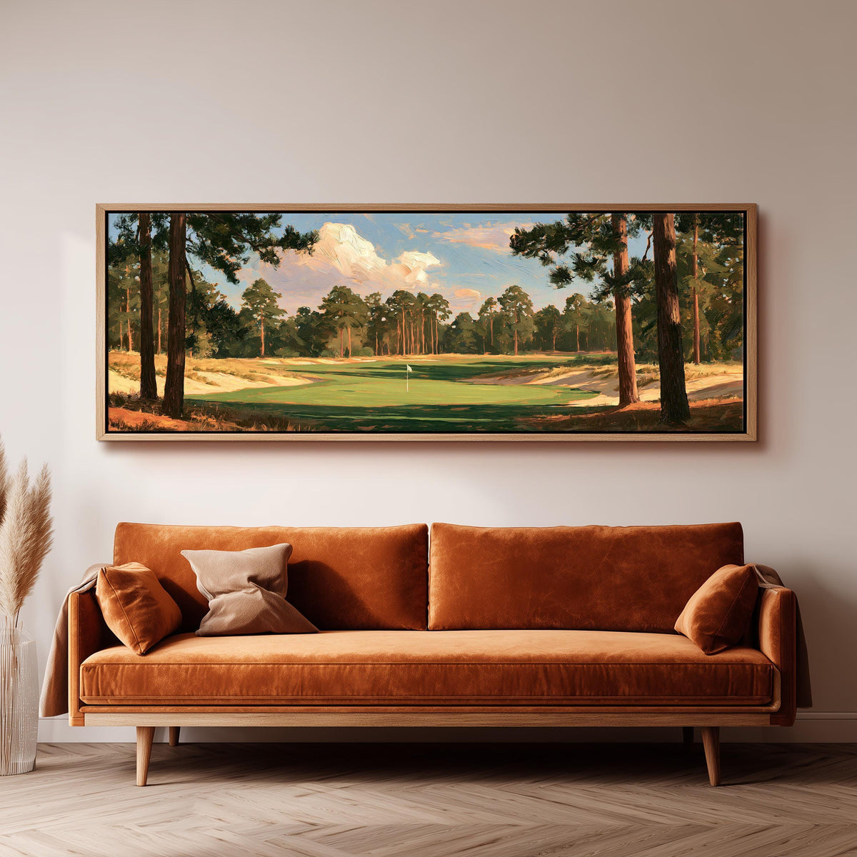 Golf fairway lined with tall pines panoramic canvas print above a sofa in a living room