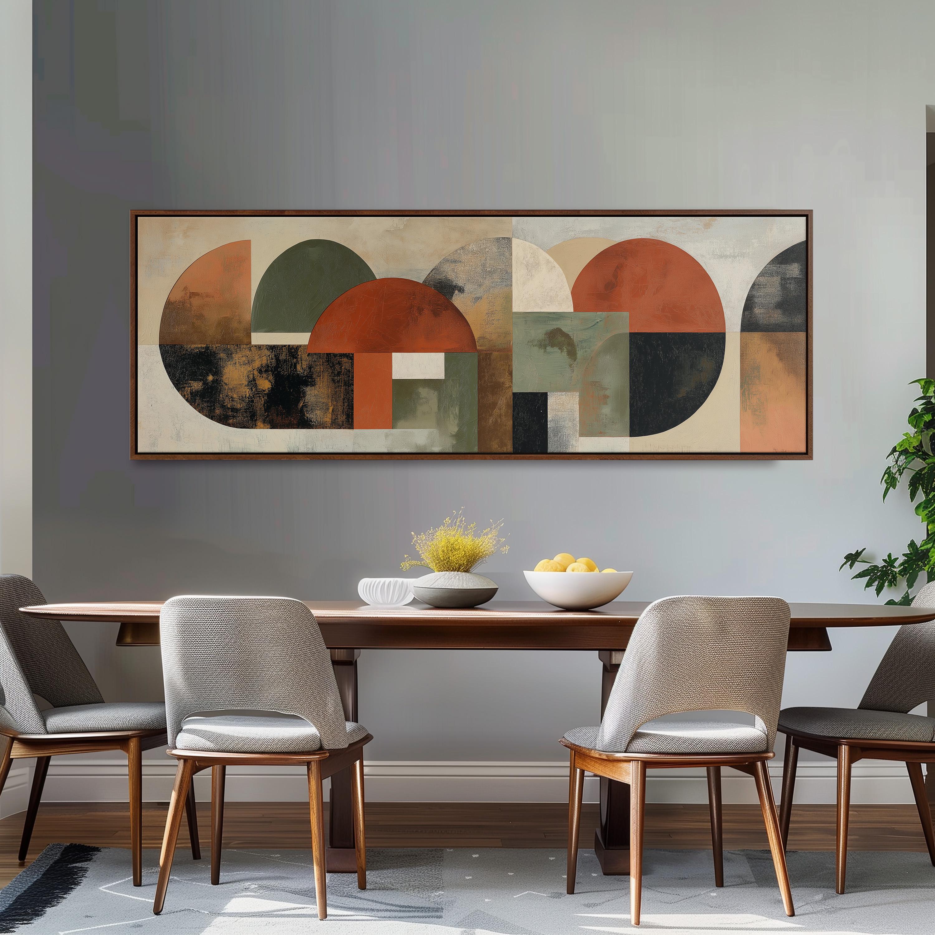 a modern dining room with a large abstract painting hanging on the wall above a wooden dining table with four chairs. The table is set with a bowl of fruit and a vase of flowers, creating a welcoming and stylish atmosphere.