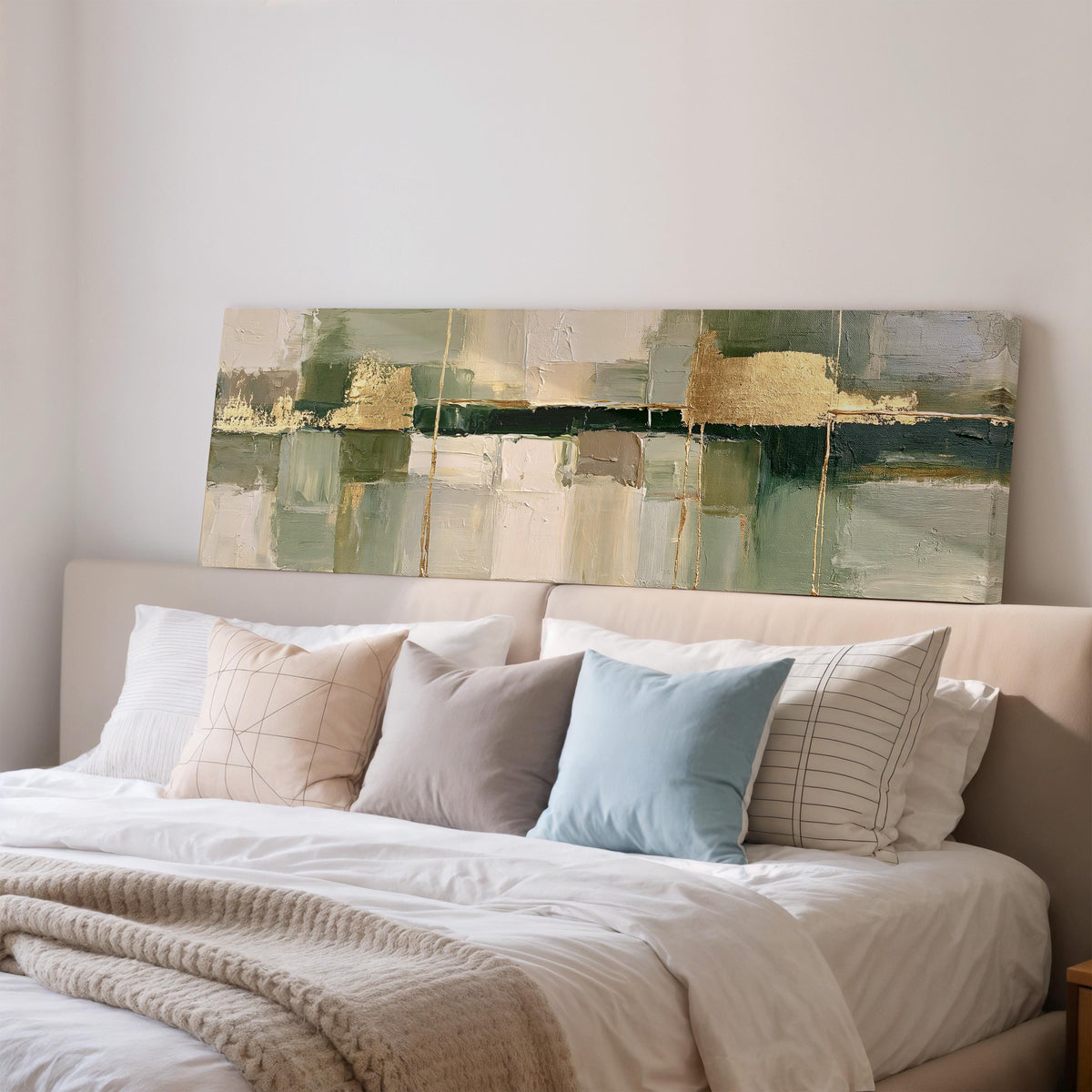 Sage and gold leaf abstract wide panoramic canvas print above a bed in a bedroom