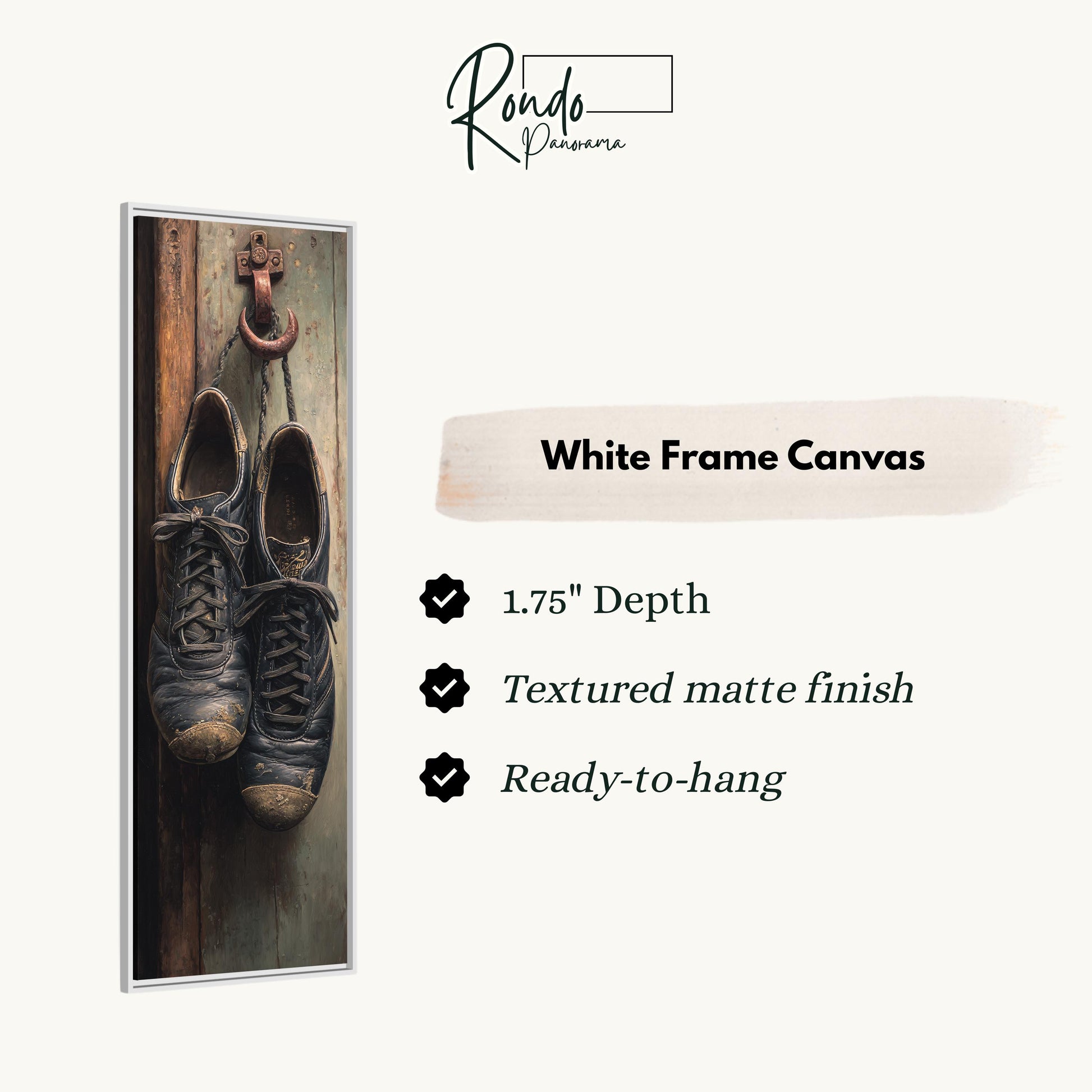a pair of black shoes hanging on a wooden wall, with a white frame canvas hanging next to them.