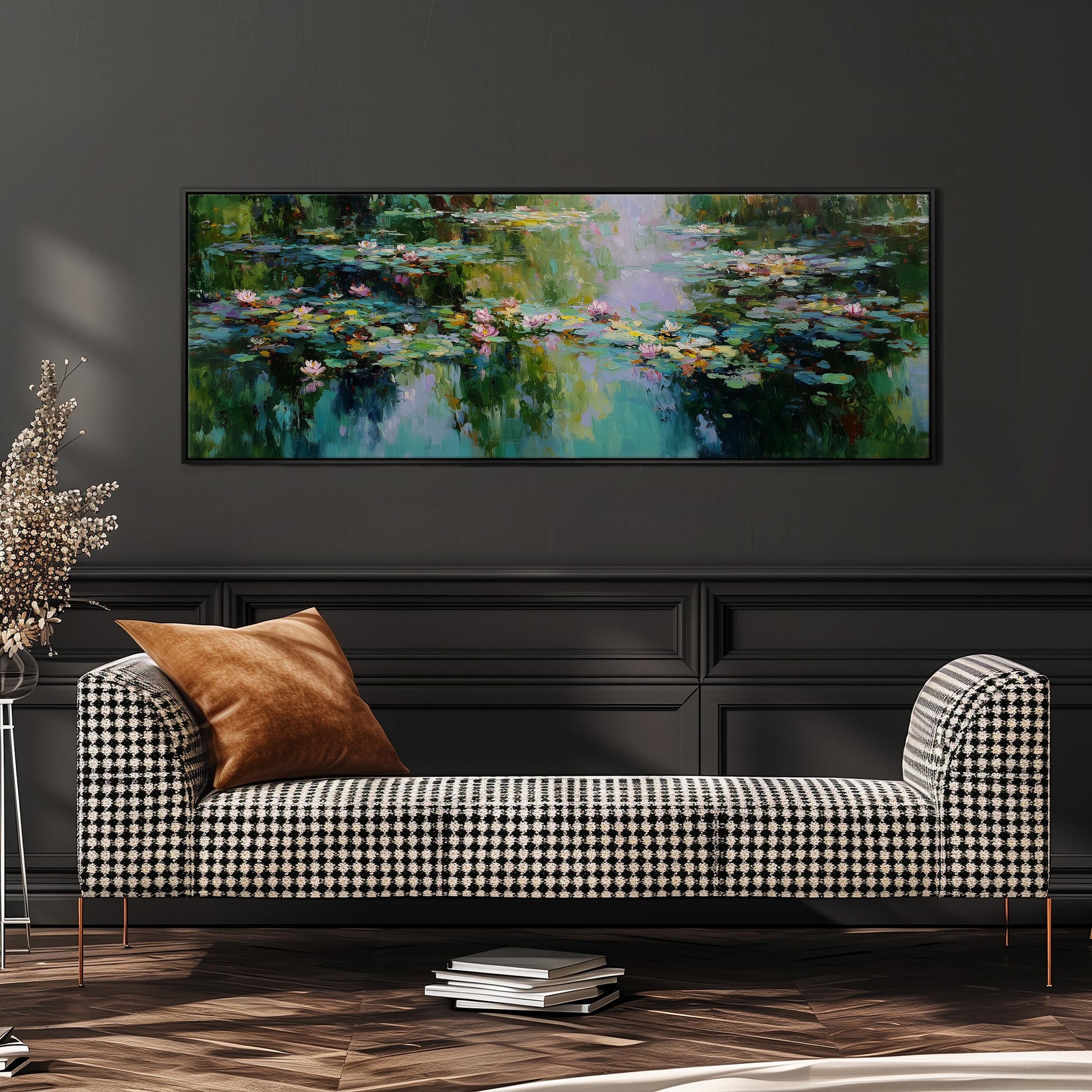 a large painting of a pond with lily pads hanging on a wall above a black and white checkered sofa.
