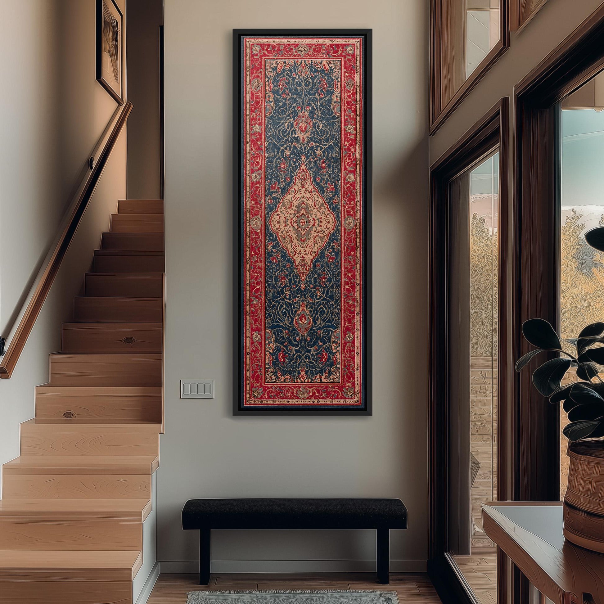 a hallway with a large, ornate rug hanging on the wall, a wooden staircase, a black bench, and a window with a plant on the sill.