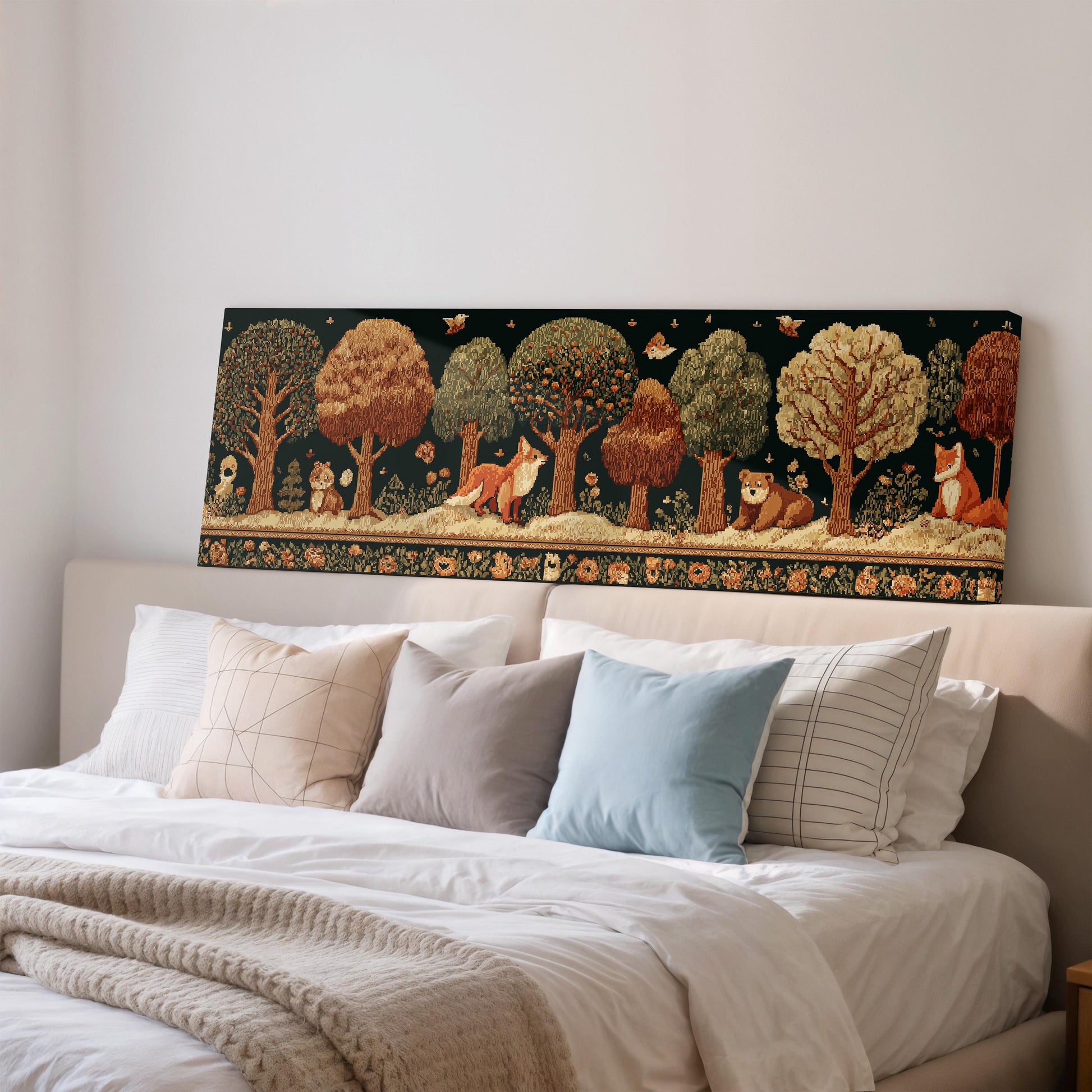 a large, ornate tapestry hanging on a wall above a bed with white pillows and a gray blanket.