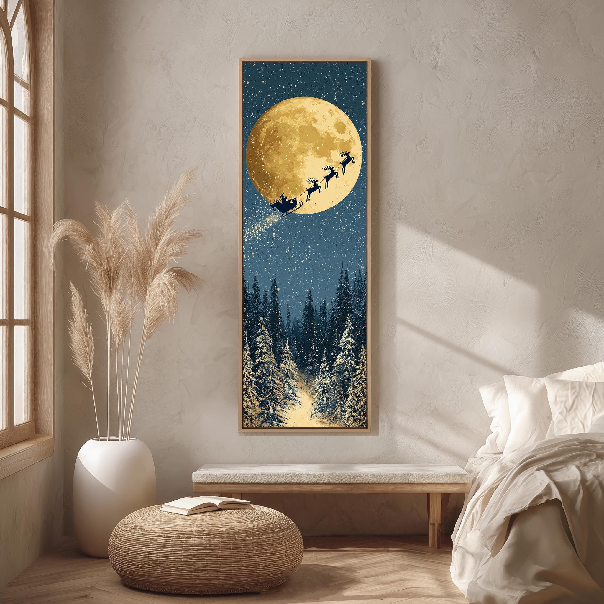a large framed picture of Santa Claus flying on a sleigh with reindeer against a night sky with a full moon.