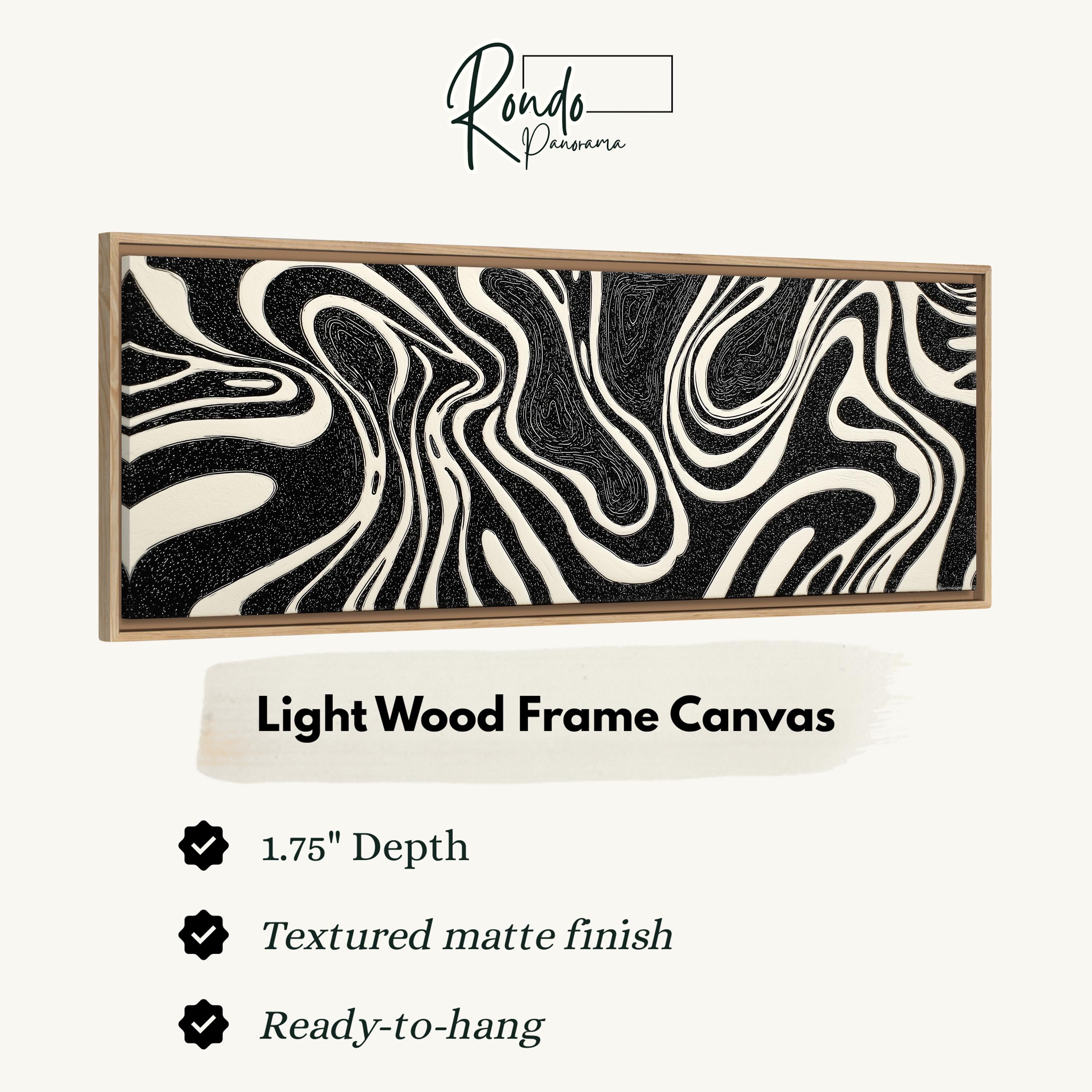 a light wood frame canvas with a black and white zebra print design.