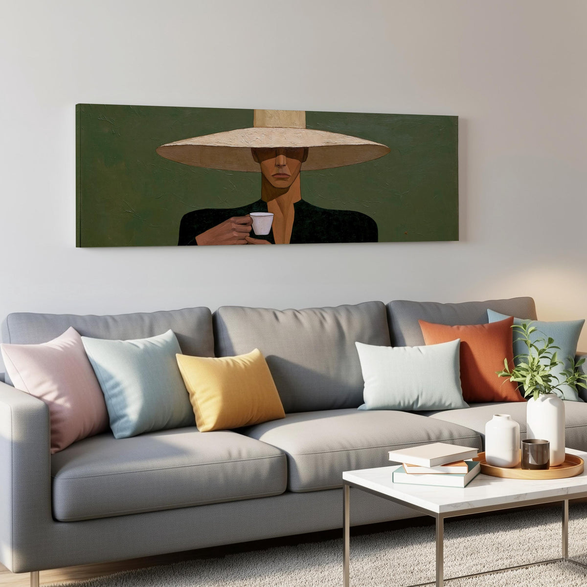 Shadowed woman in a sun hat with espresso panoramic canvas print above a grey sofa in a living room