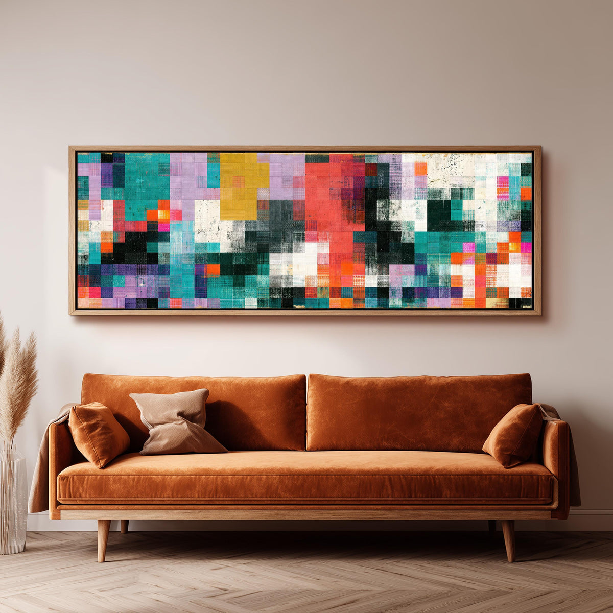 Teal and coral patchwork color blocks wide panoramic canvas print above a bench in a dark living room