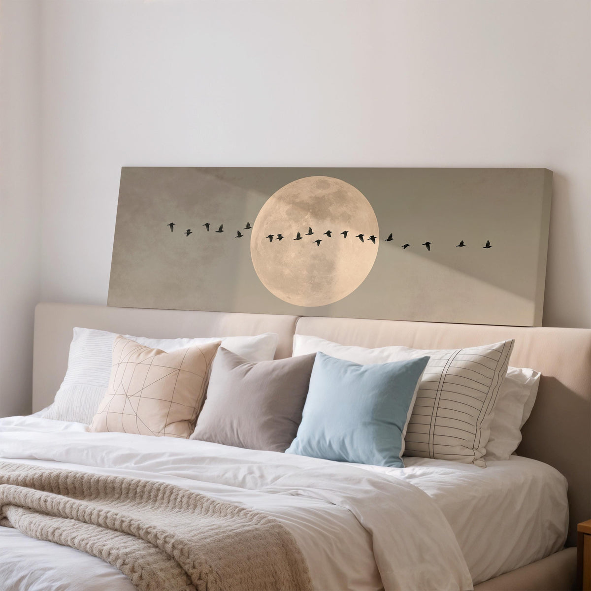 Geese crossing a full moon on grey wide panoramic canvas print above a bed in a bedroom