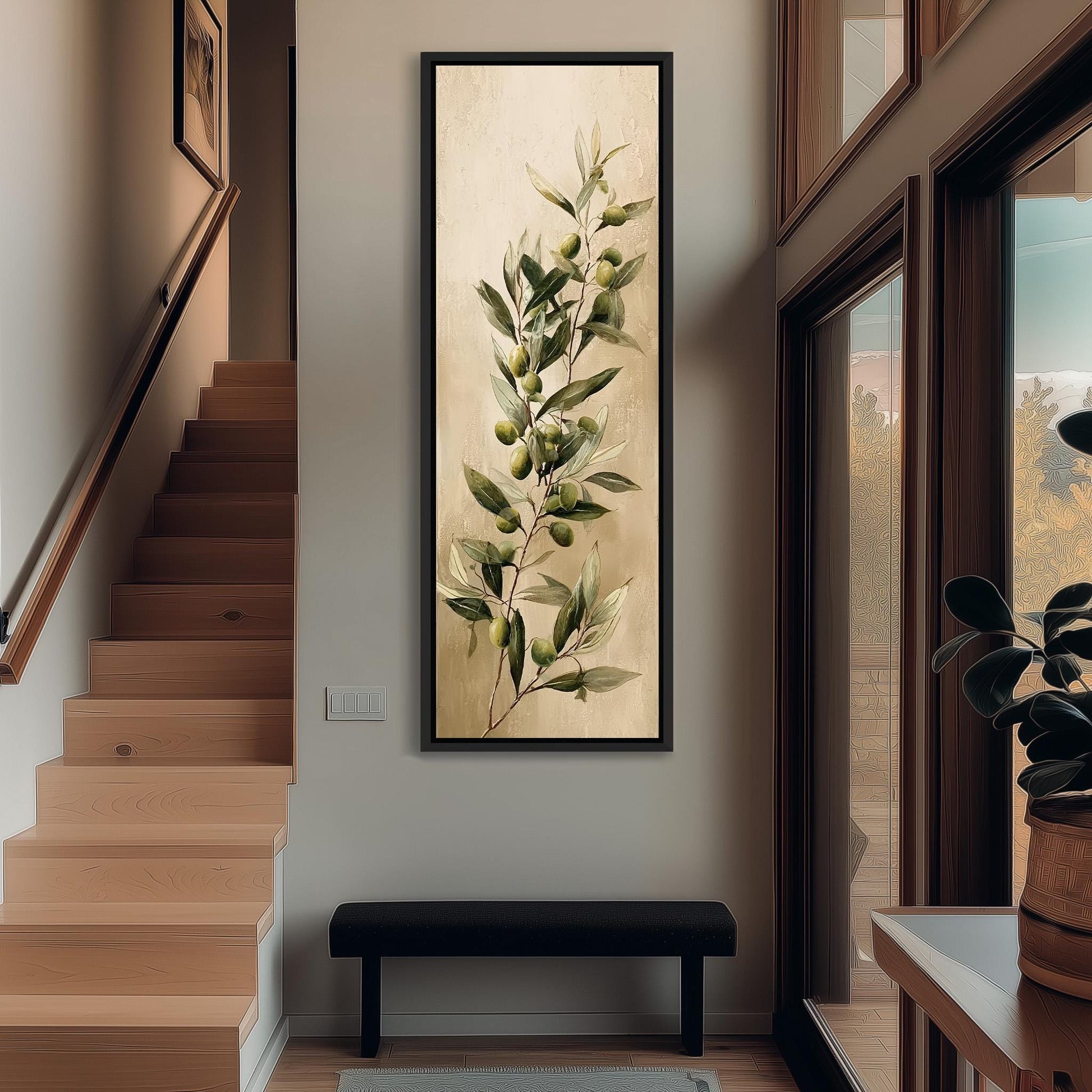 a hallway with a large painting of an olive tree hanging on the wall. The painting is framed and appears to be a decorative piece. The hallway has a wooden staircase and a bench, creating a cozy and inviting atmosphere.