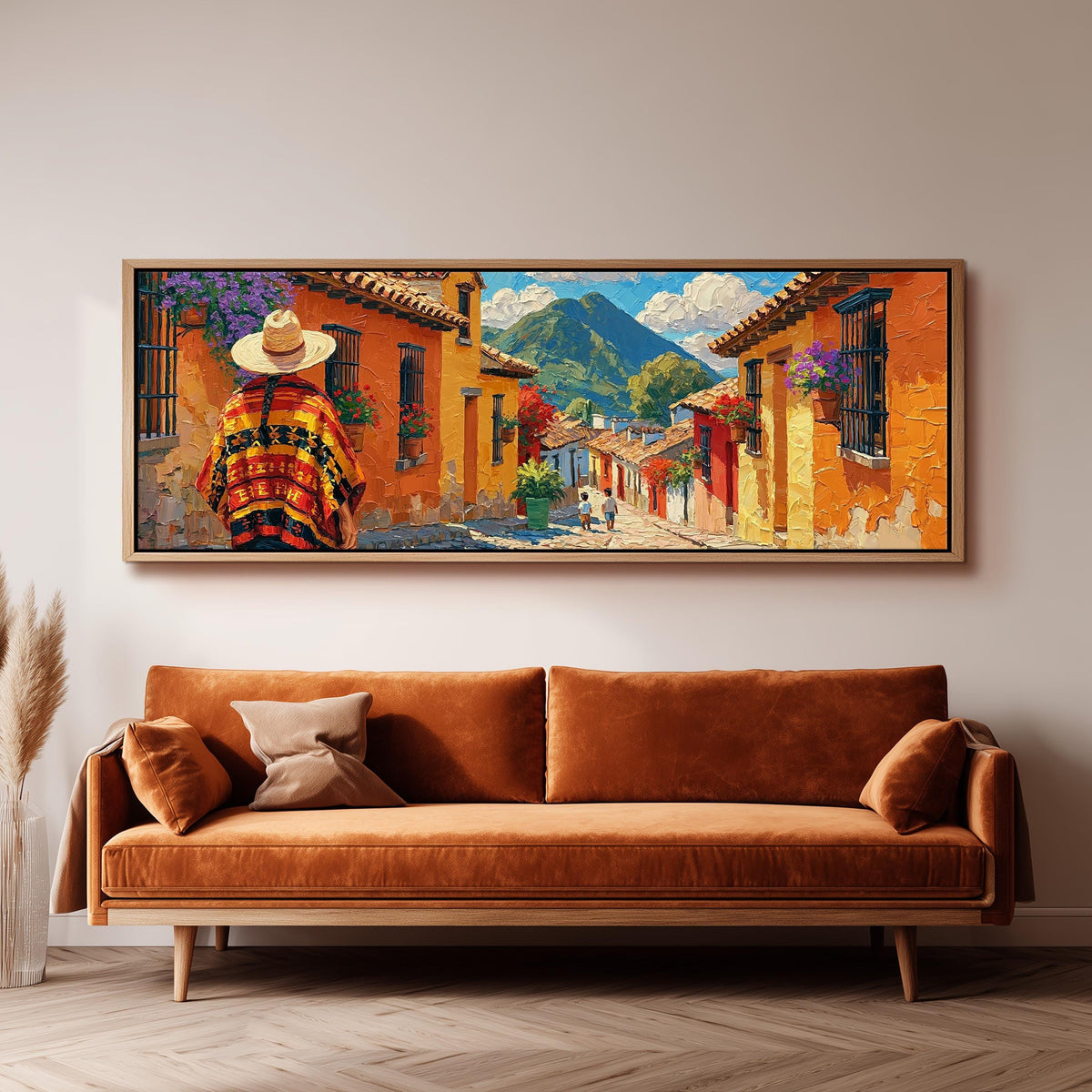 Colorful Guatemalan street with volcano view panoramic canvas print above a sofa in a living room