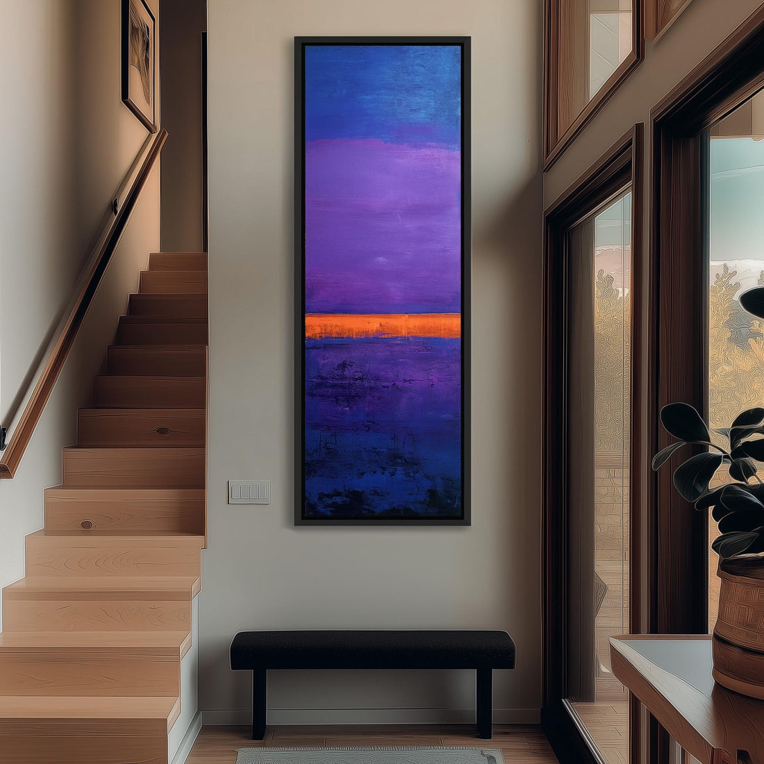 a large, rectangular painting hanging on a wall, depicting a vibrant sunset scene with a purple sky and an orange horizon.