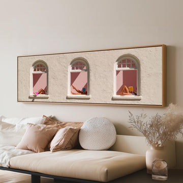 Women reading in three arched windows long horizontal canvas print above a sofa in a living room