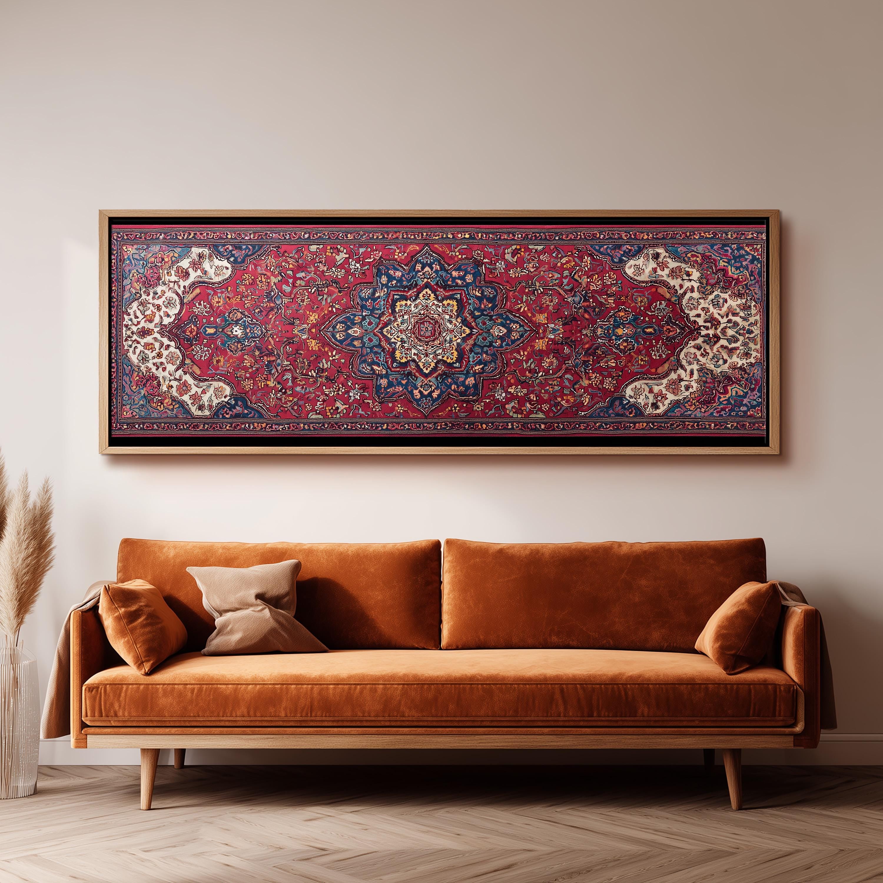 a large, ornate rug hanging on a wall above a brown sofa with two pillows.