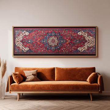 a large, ornate rug hanging on a wall above a brown sofa with two pillows.