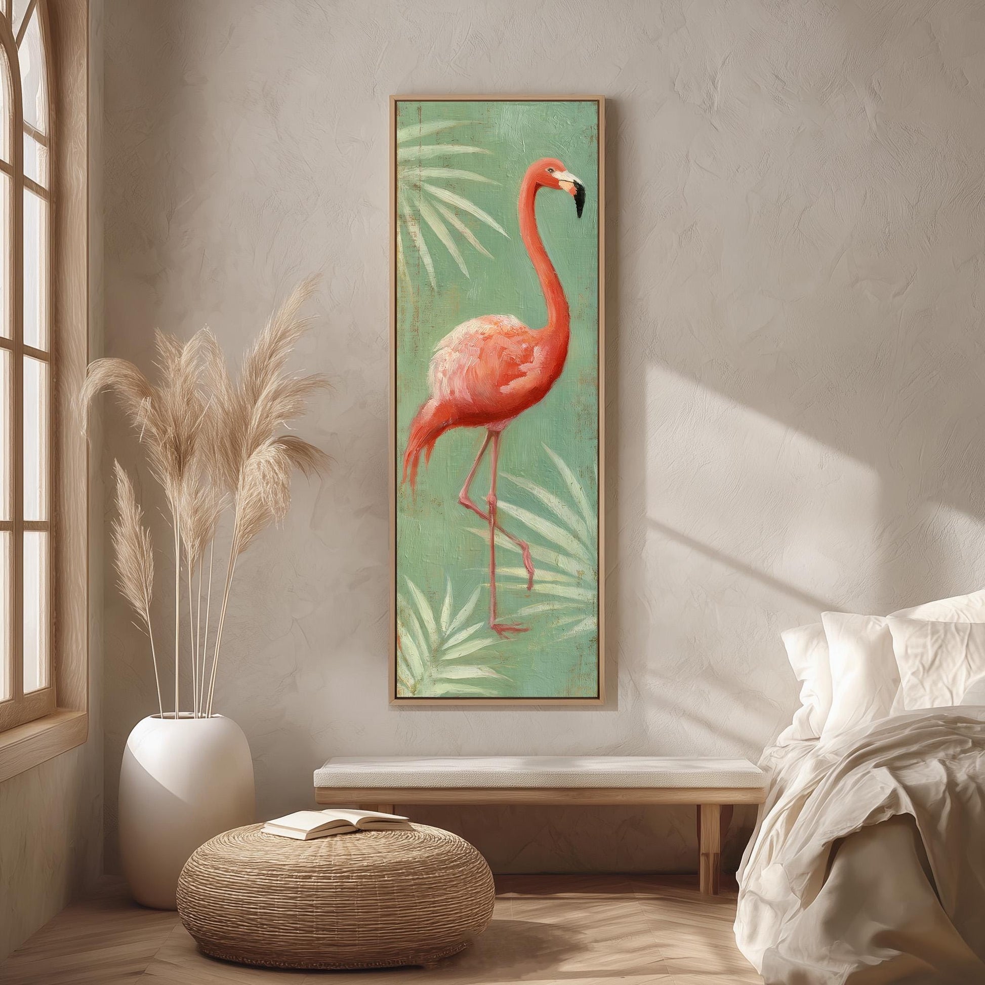 a large framed painting of a flamingo standing on one leg, hanging on a wall in a room with a bed, a potted plant, and a woven ottoman.