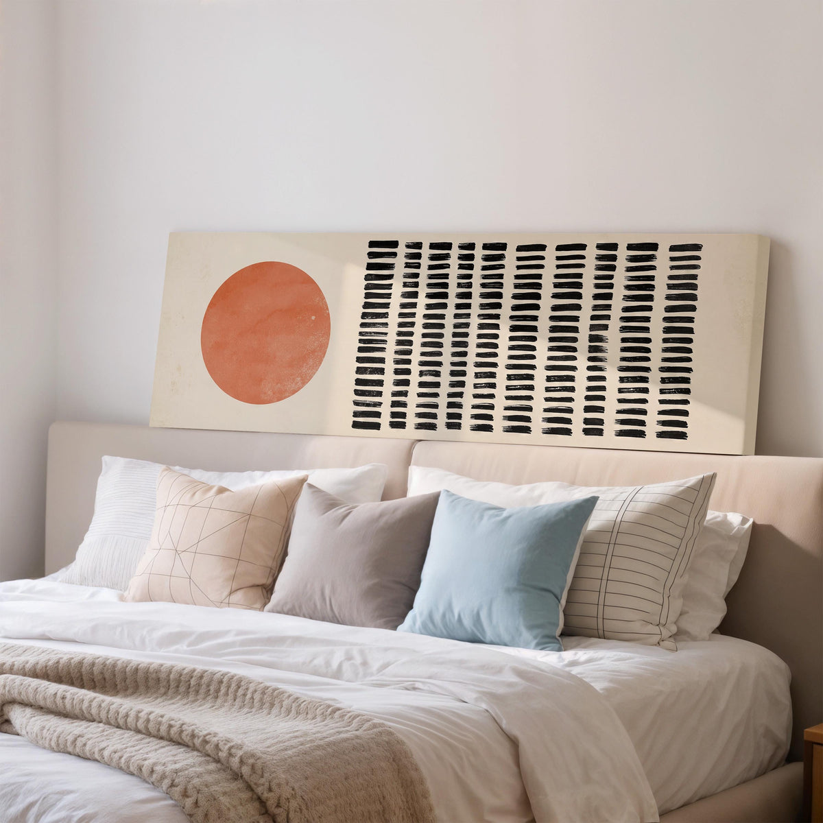 Orange sun beside rows of black dashes wide panoramic canvas print above a bed in a bedroom