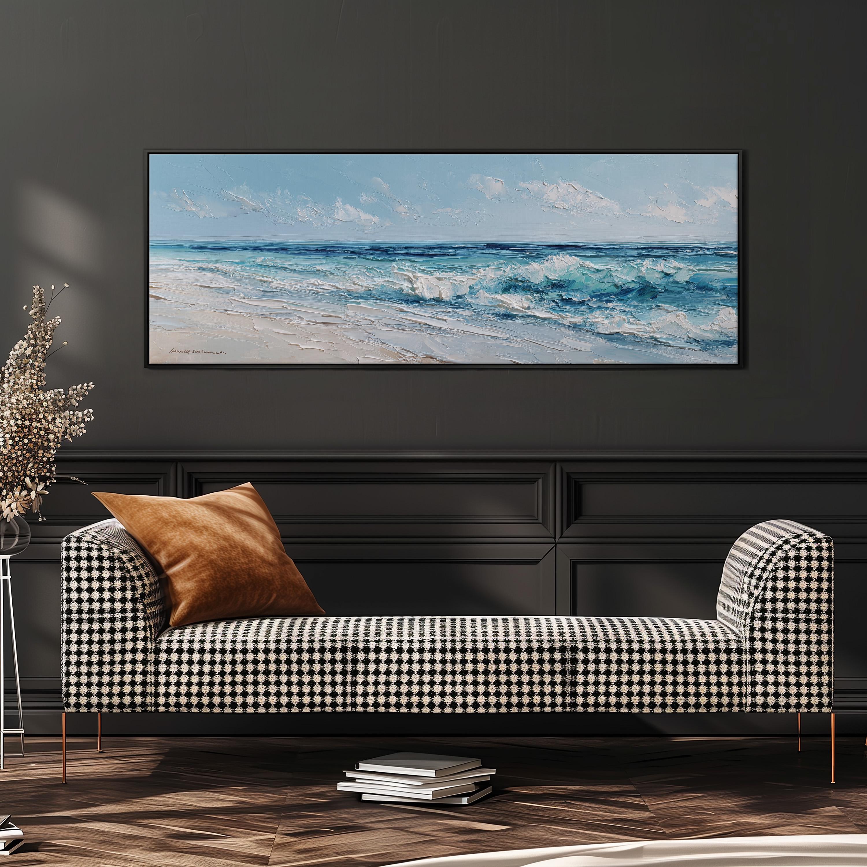 a large painting of a beach scene hanging on a wall above a black and white checkered sofa with a brown throw pillow.