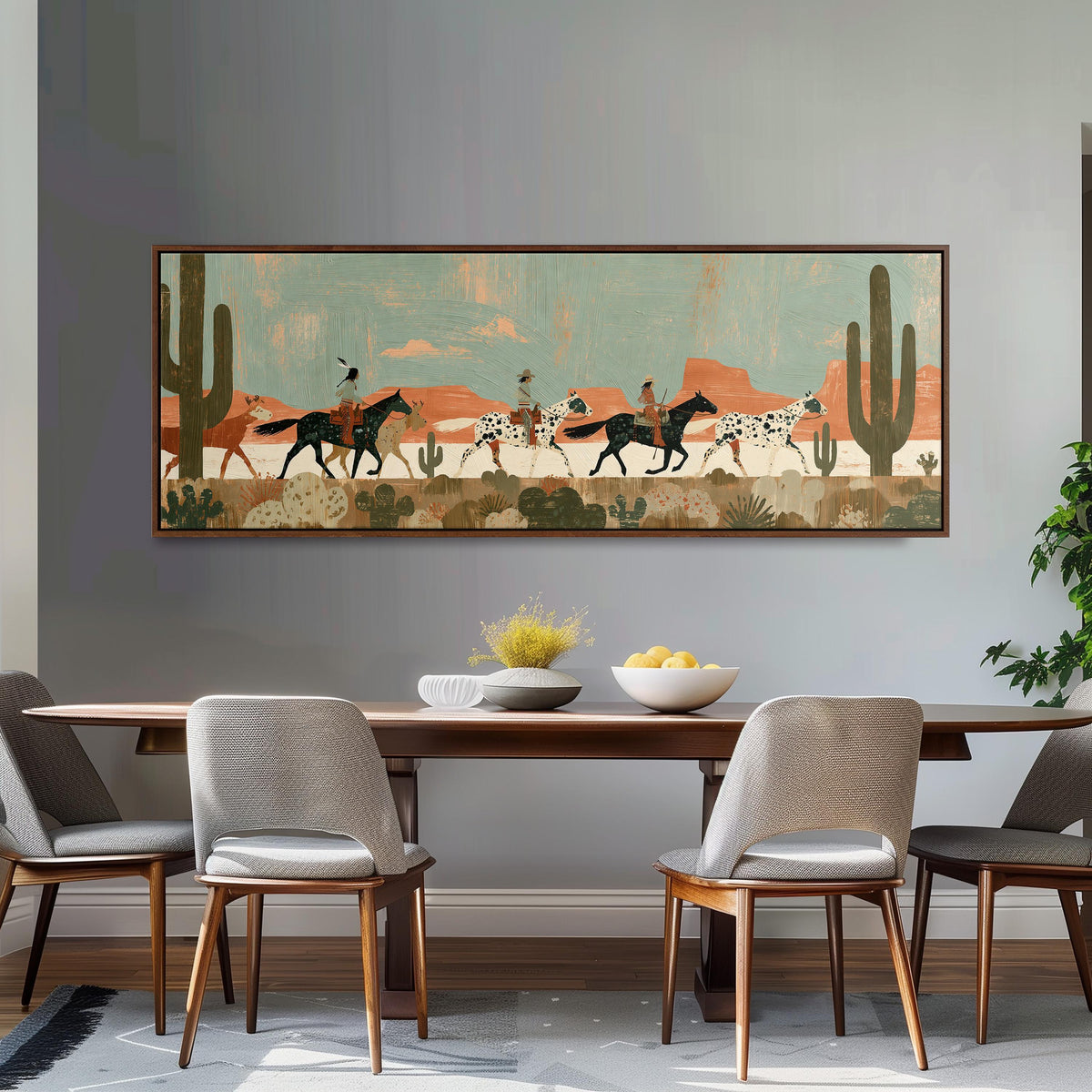 Riders on spotted horses across a red rock desert long horizontal canvas print above a dining table