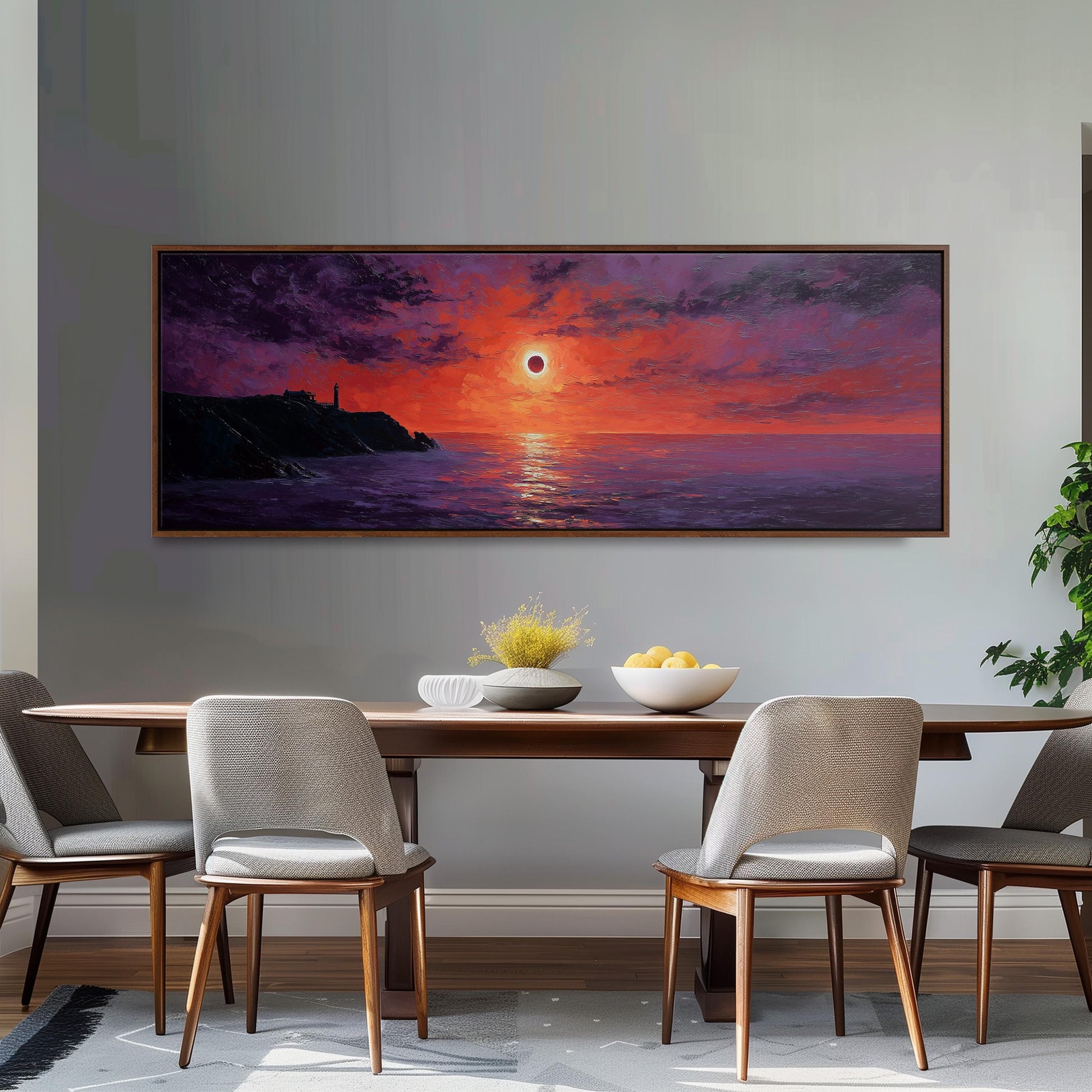 a large painting of a sunset over the ocean, with a total of four chairs surrounding a wooden dining table. The painting is hung on a wall above the table, creating a focal point in the room.