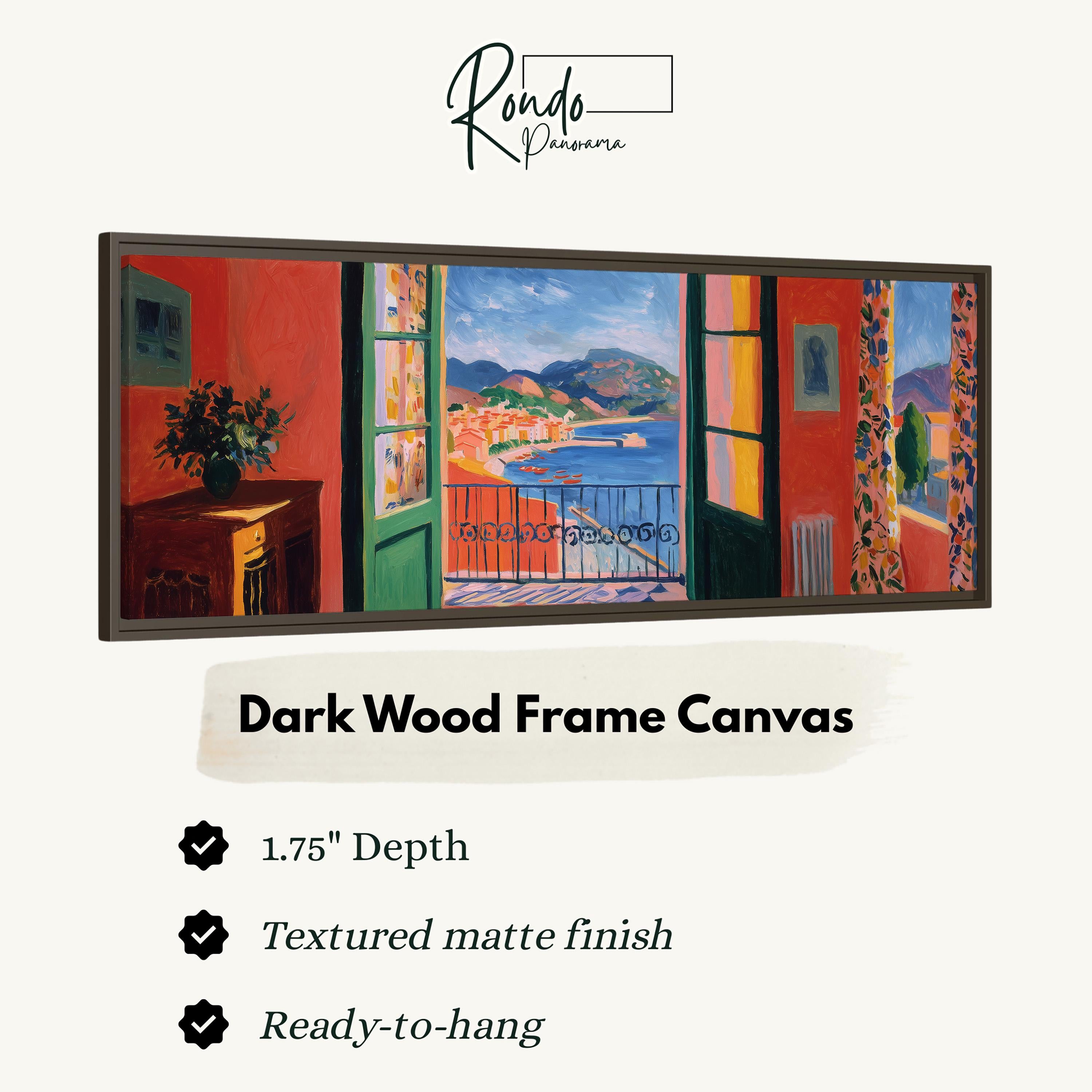 The image is a dark wood frame canvas depicting a coastal town with colorful buildings and a view of the ocean through open windows.