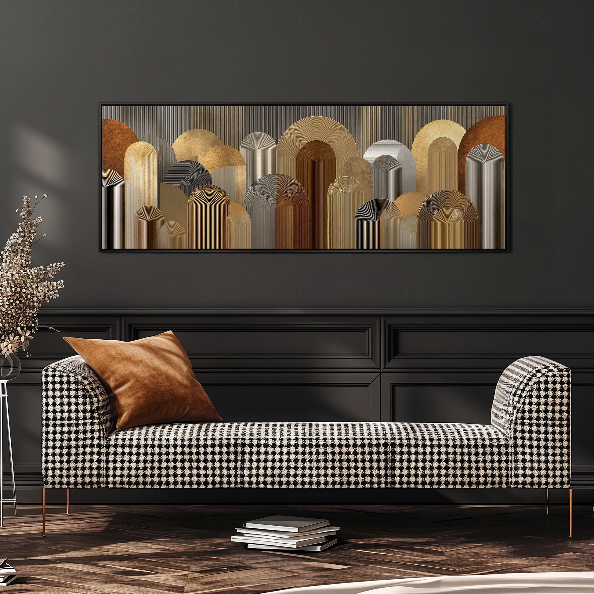 a modern living room with a black and white checkered sofa, a large abstract painting on the wall, and a stack of books on the floor.