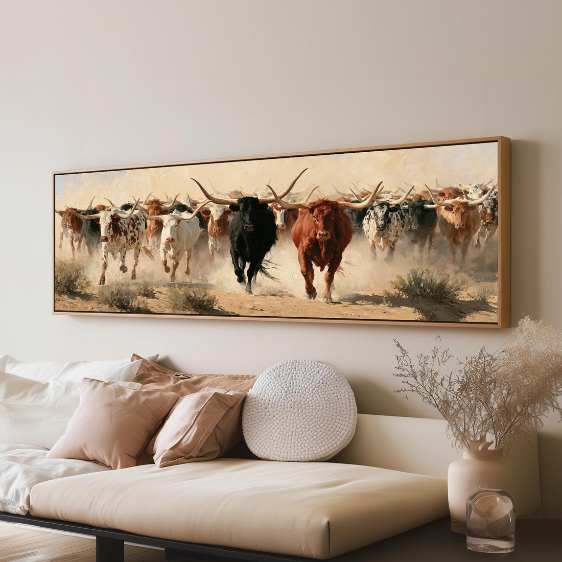 Longhorn cattle stampede long horizontal canvas print above a sofa in a living room
