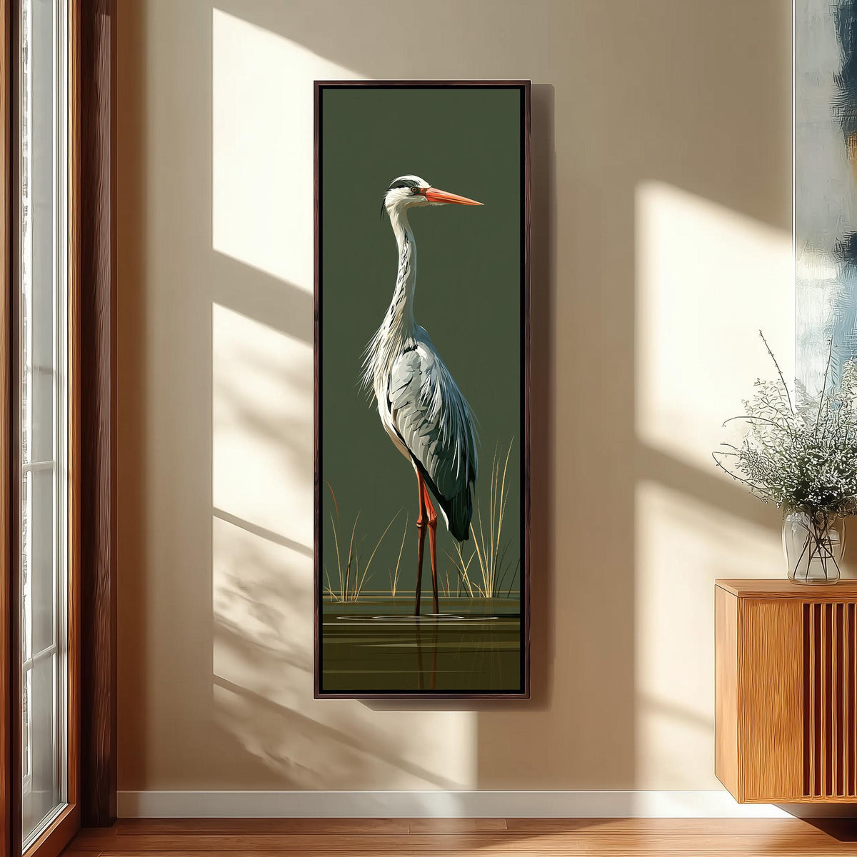 Grey heron standing on olive green long vertical canvas print in a sunlit living space