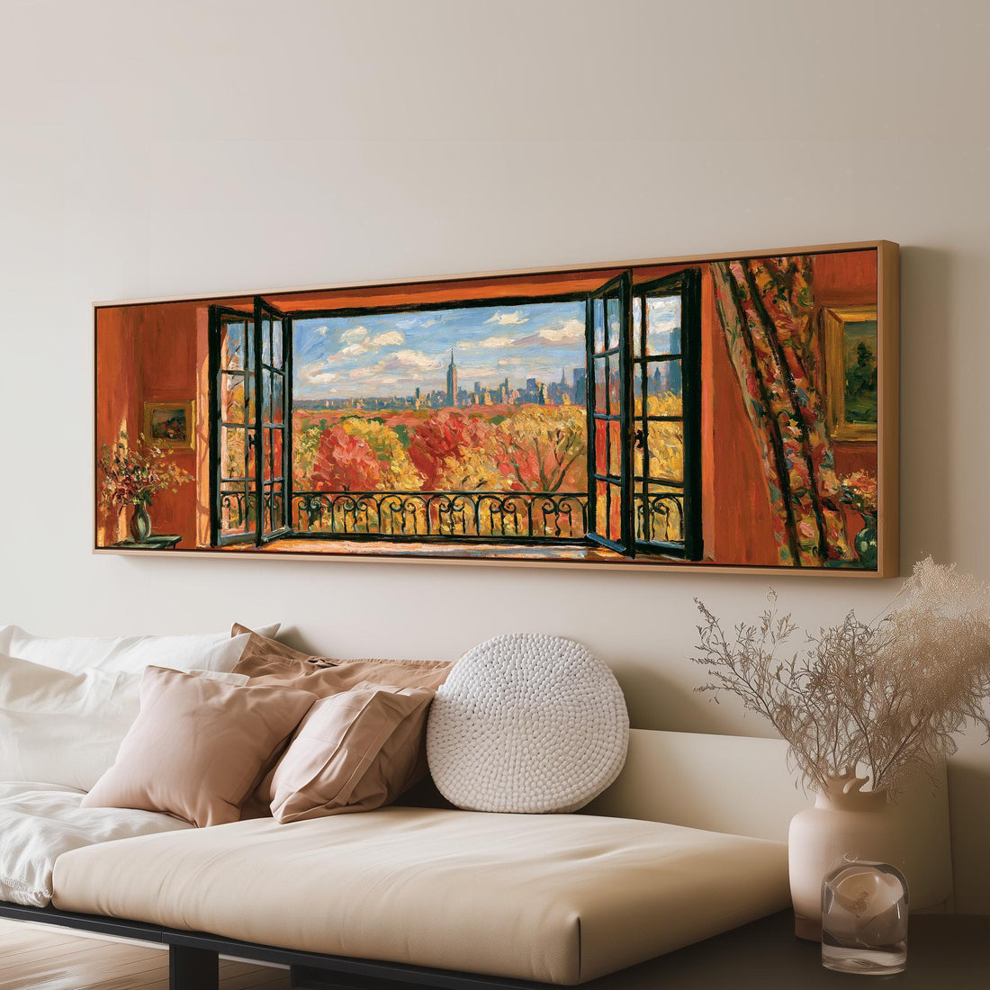 Autumn park and city skyline through a red room window long horizontal canvas print above a sofa in a living room
