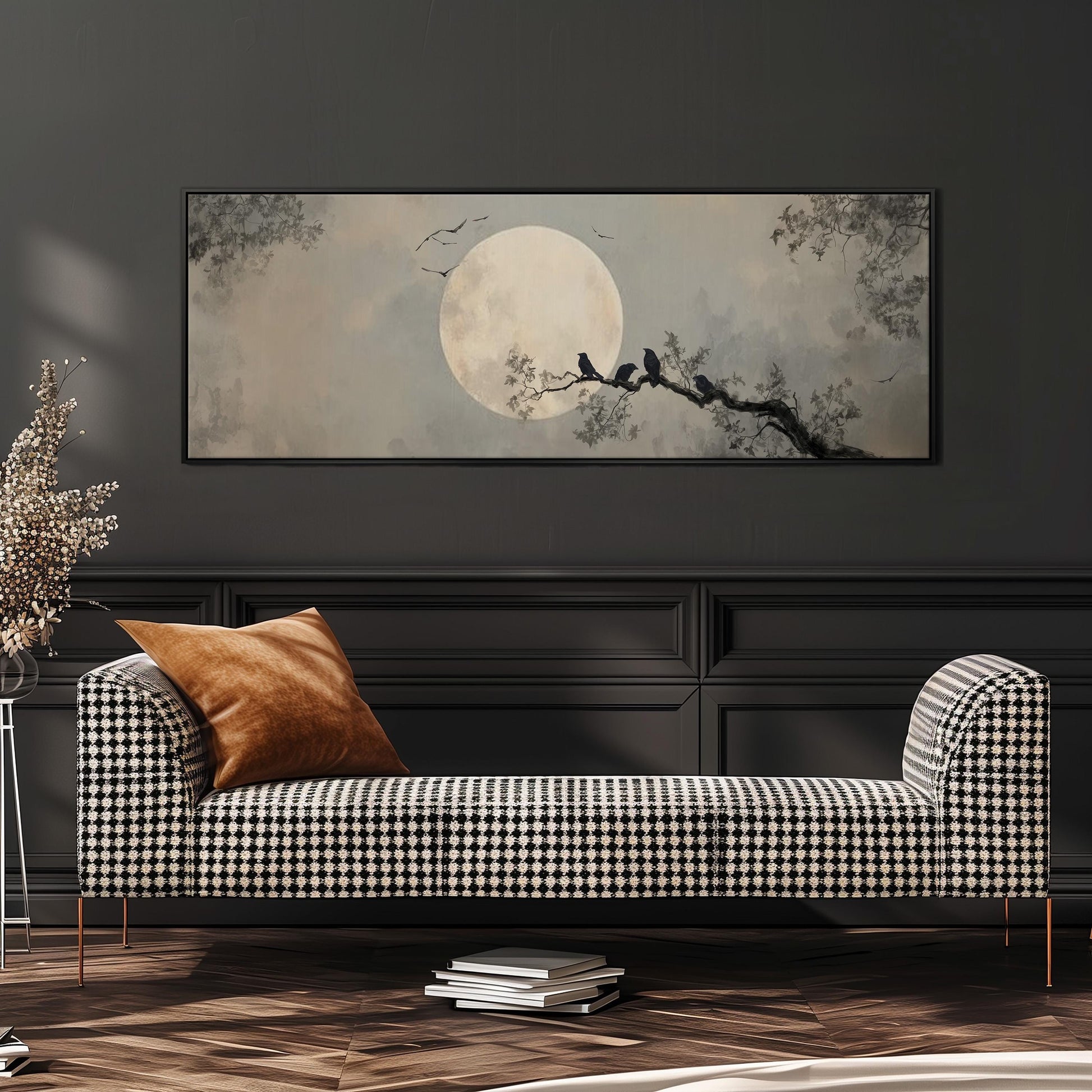 a large black and white checkered sofa with a brown throw pillow, set against a dark wall with a framed painting of a moonlit night scene above it.