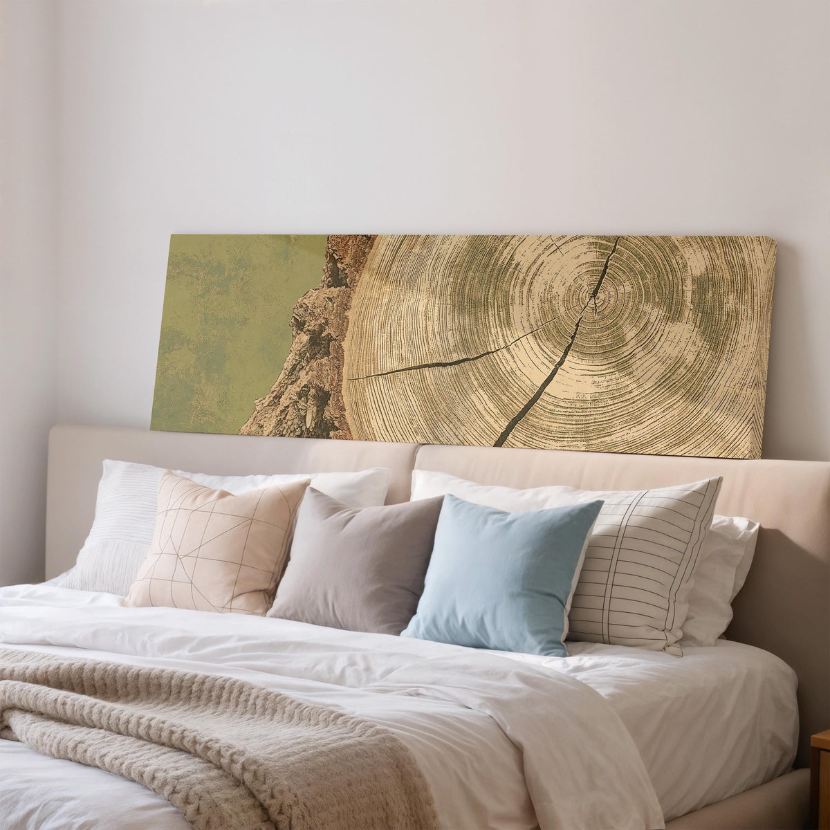 Golden tree ring wood grain wide panoramic canvas print above a bed in a bedroom