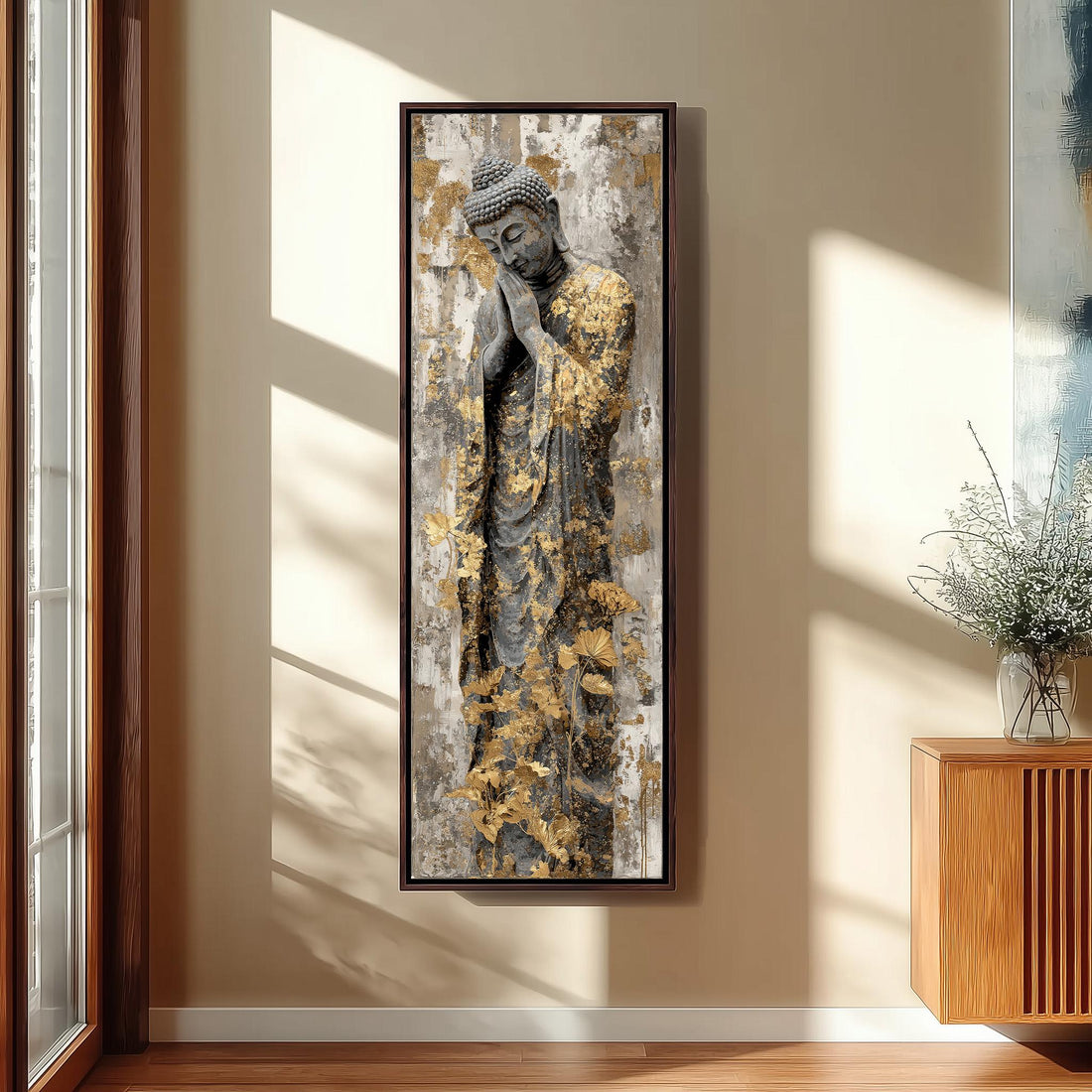 a large Buddha statue with golden leafy patterns on its robe, displayed on a wall in a minimalist living room setting.