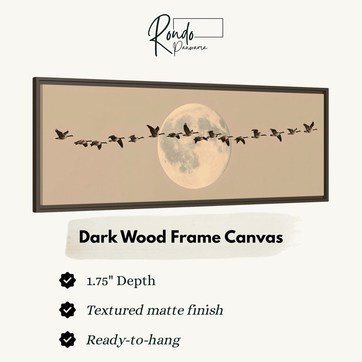 Geese flying across a pale moon on sand canvas print in a dark wood floating frame