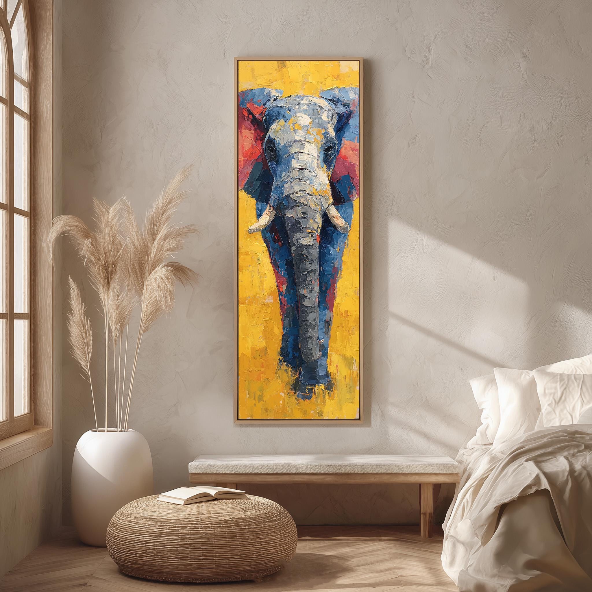 a large, colorful painting of an elephant hanging on a wall in a room with a wooden floor and a white bed.