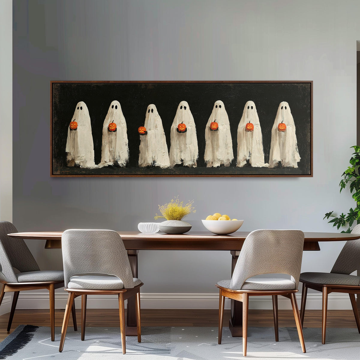 Row of ghosts holding pumpkins long horizontal canvas print above a dining table