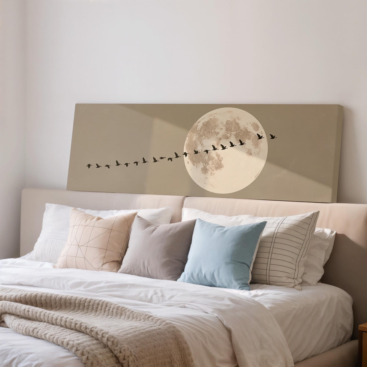 Geese flying past a full moon wide panoramic canvas print above a bed in a bedroom