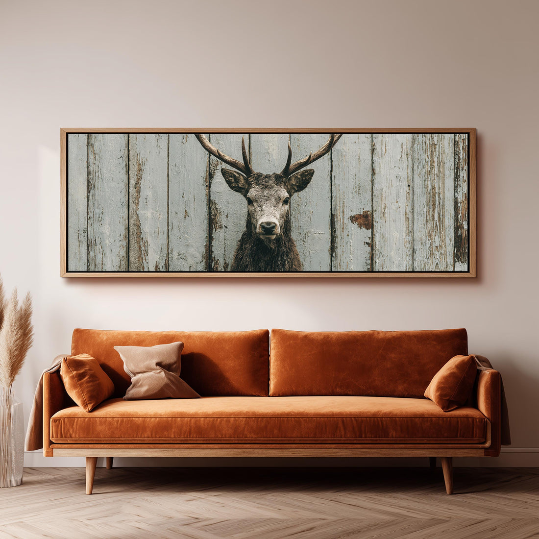 Monochrome stag on barn wood long horizontal canvas print above a sofa in a living room