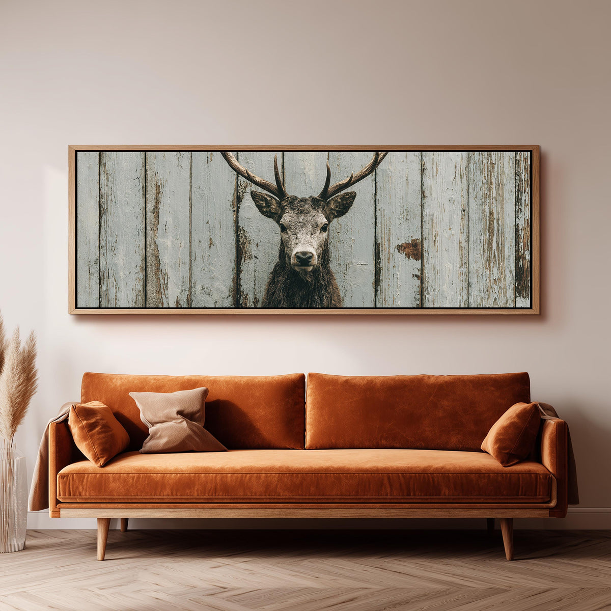 Monochrome stag on barn wood long horizontal canvas print above a sofa in a living room