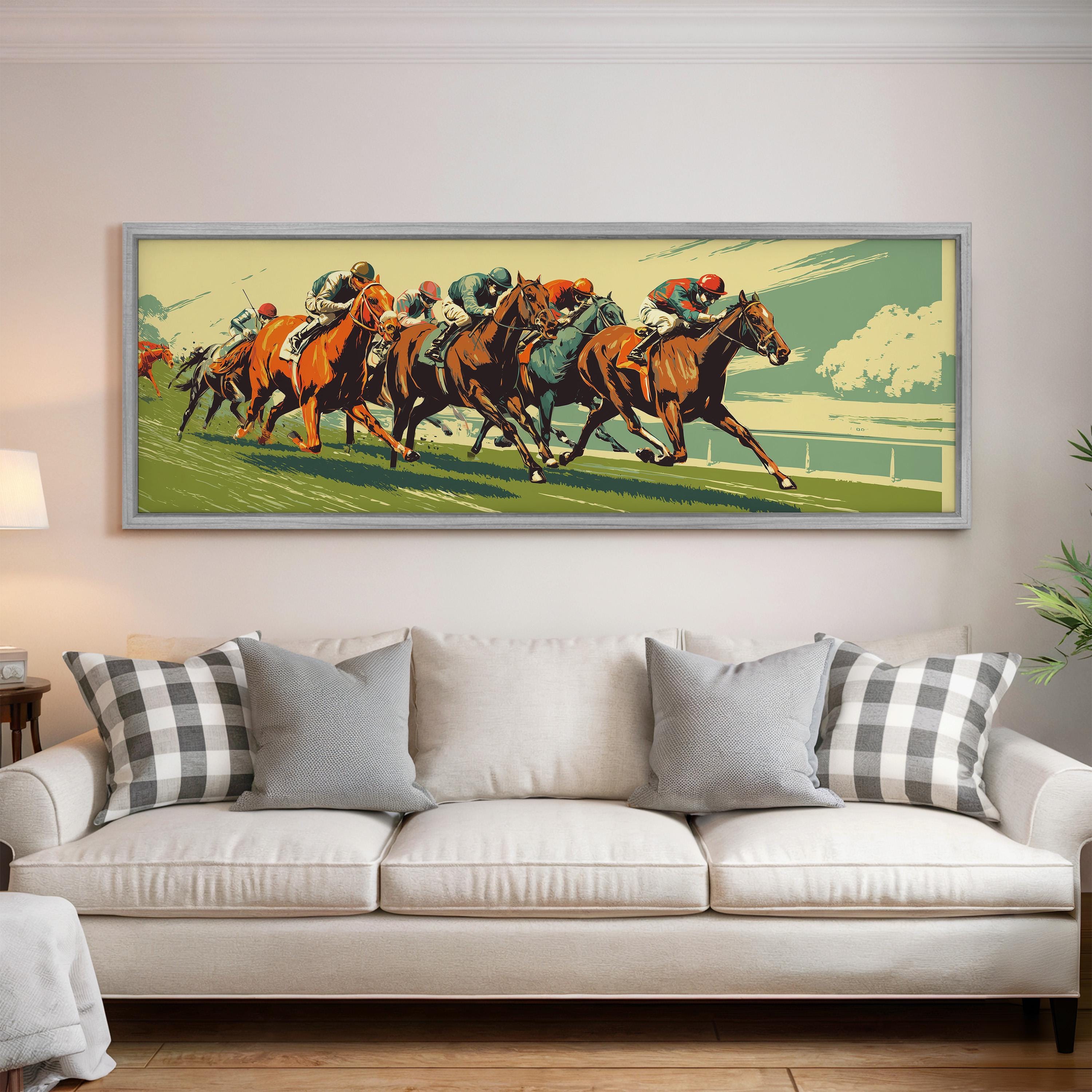 a large framed painting of a horse race on the wall of a living room, with a white sofa and a potted plant in the foreground.