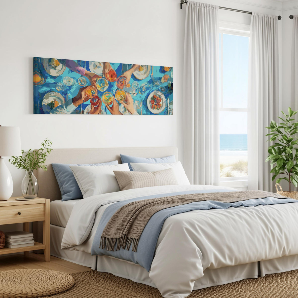 Friends toasting over a blue table from above panoramic canvas print above a bed in a coastal bedroom