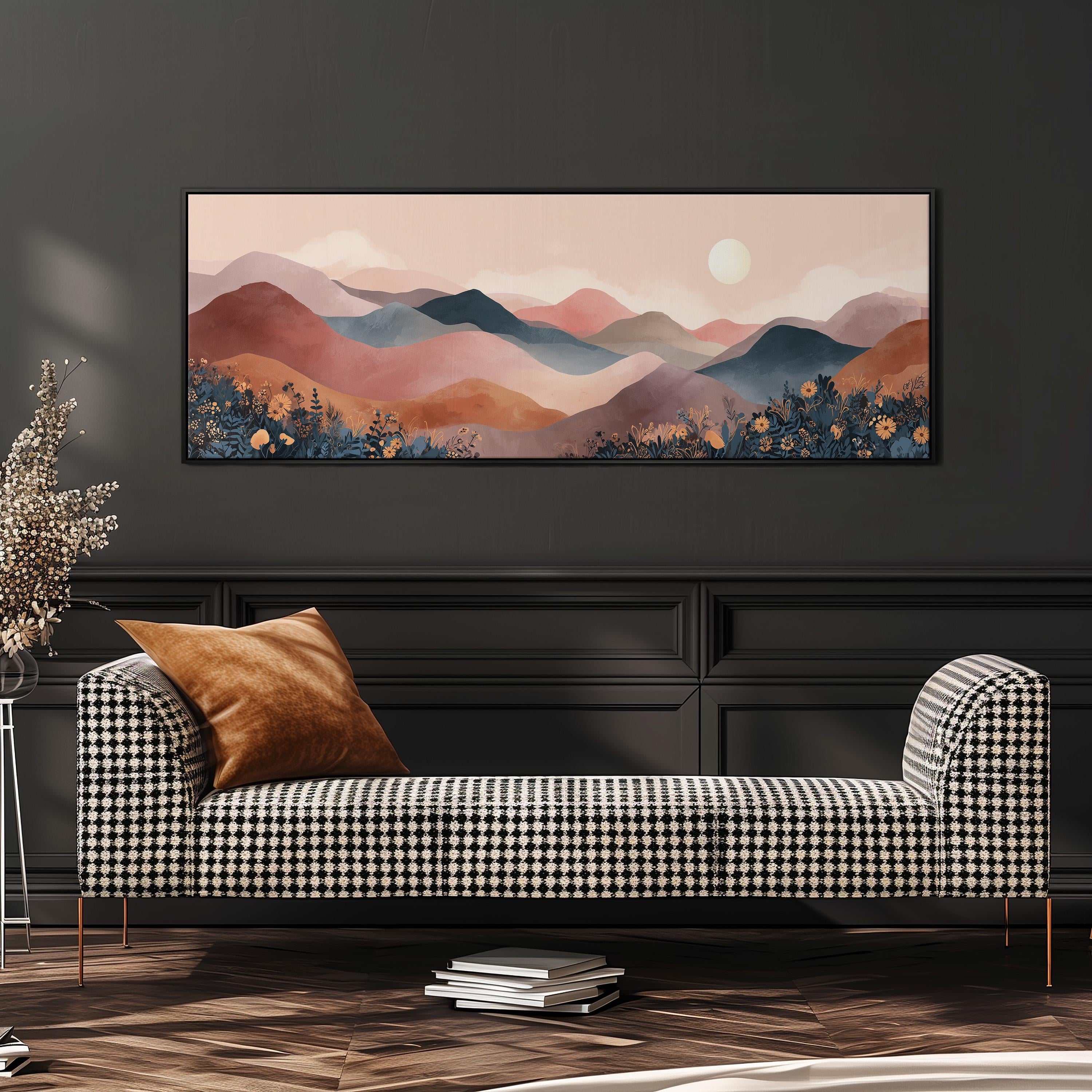 a large, rectangular landscape painting hanging on a wall above a black and white checkered sofa.