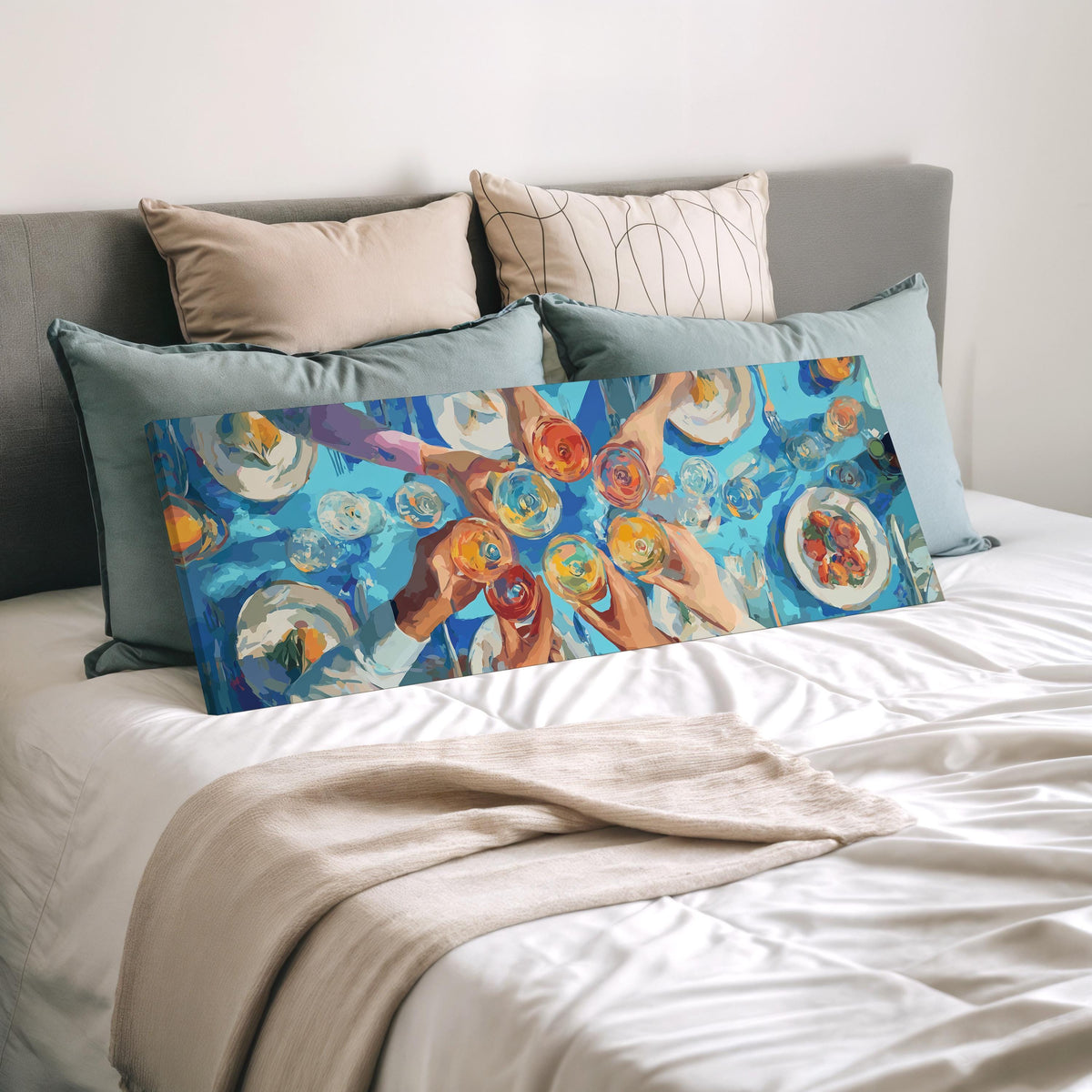 Friends toasting over a blue table from above wide panoramic canvas print laid on a bed to show its size
