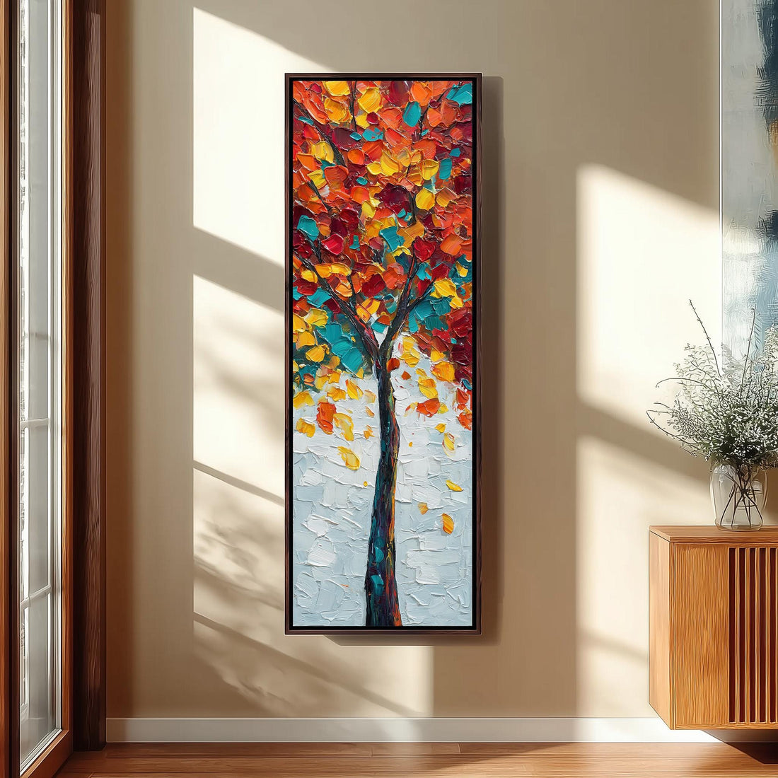 a large, colorful painting of a tree with vibrant leaves hanging on a wall in a room with a wooden floor and a window.