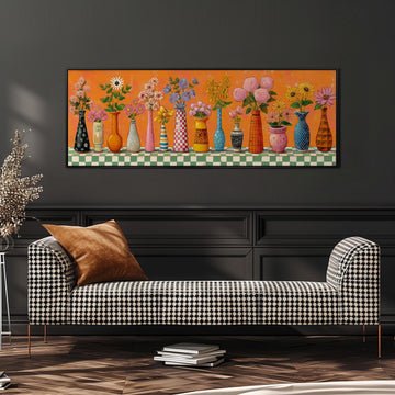 a checkered sofa with a large, colorful painting of various vases and flowers displayed above it.