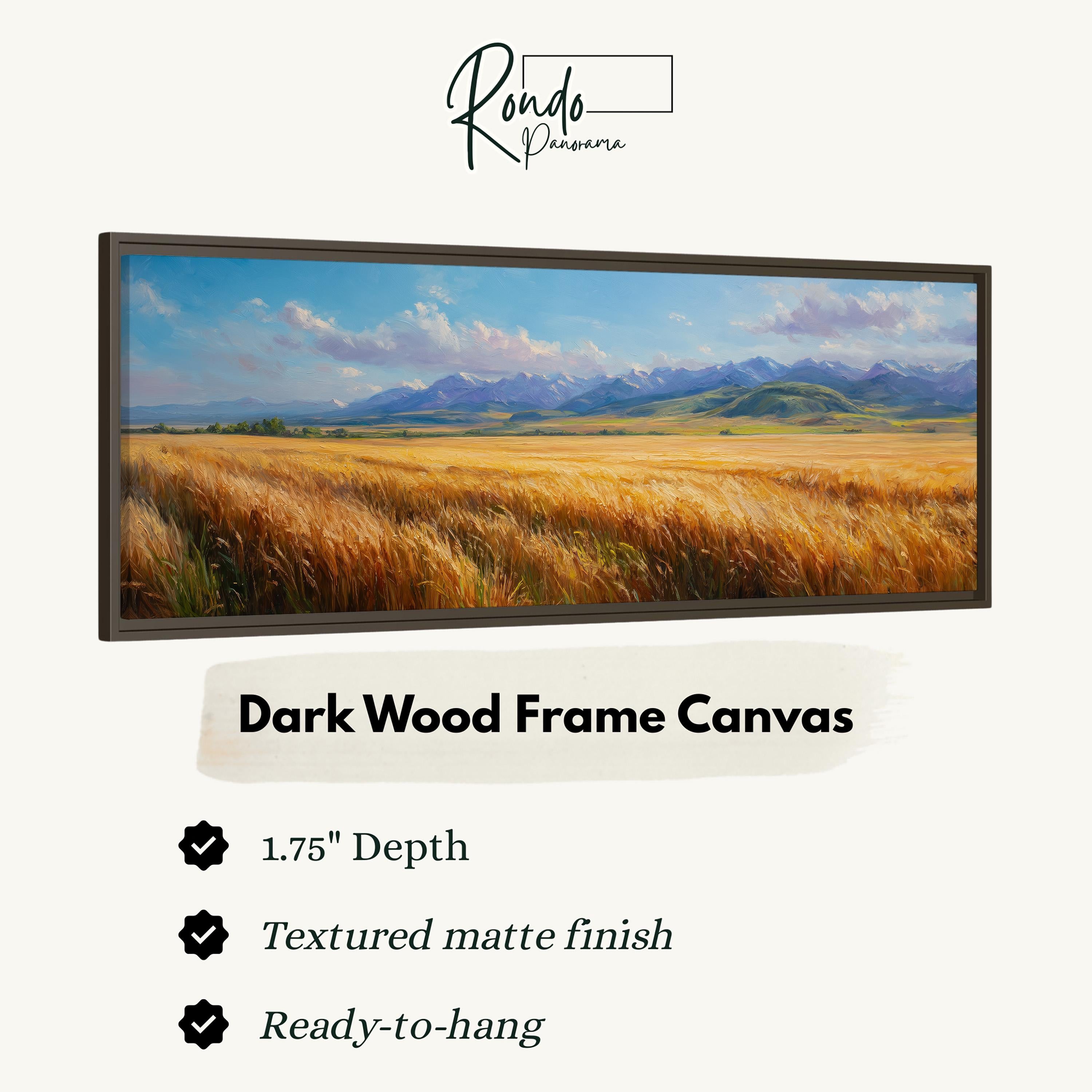 The image is a framed painting of a field of golden wheat against a backdrop of mountains.