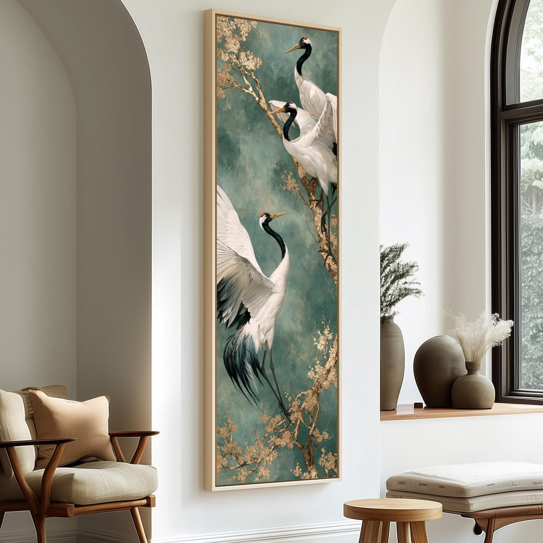 Cranes perched on a blossom branch long vertical canvas print in a sunlit living space