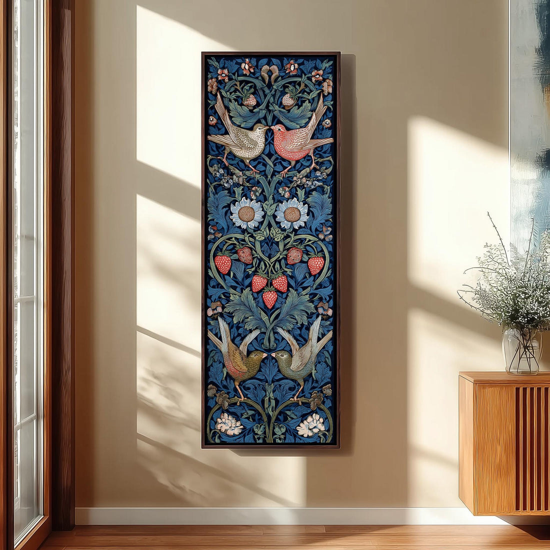 a hallway with a large, colorful tapestry hanging on the wall, depicting a floral design with birds and flowers. The hallway has a wooden staircase and a bench, and there is a plant in a pot on the right side of the image.